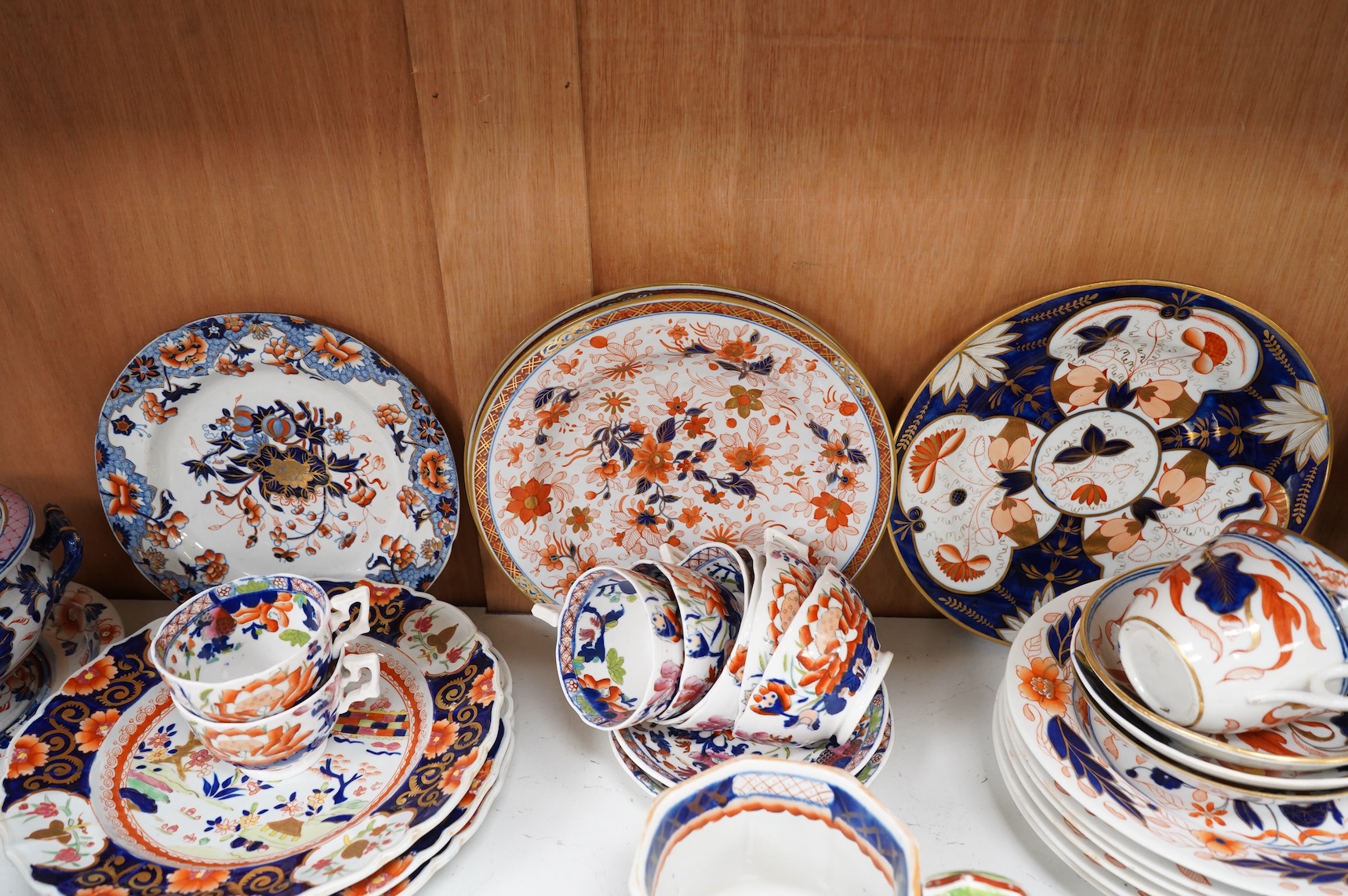 A collection of 19th century English ironstone china to include two pairs of sauce tureens, covers and stands, one marked Masons, various side plates and teacups